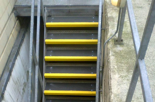 Anti-slip stair treads cover slippery steel stairs. Anti-slip stair treads cover slippery steel stairs.
