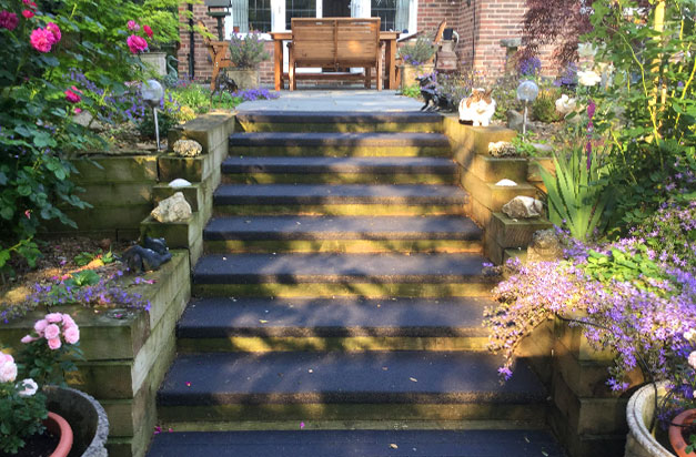 Black anti slip stair treads garden landscape installation.